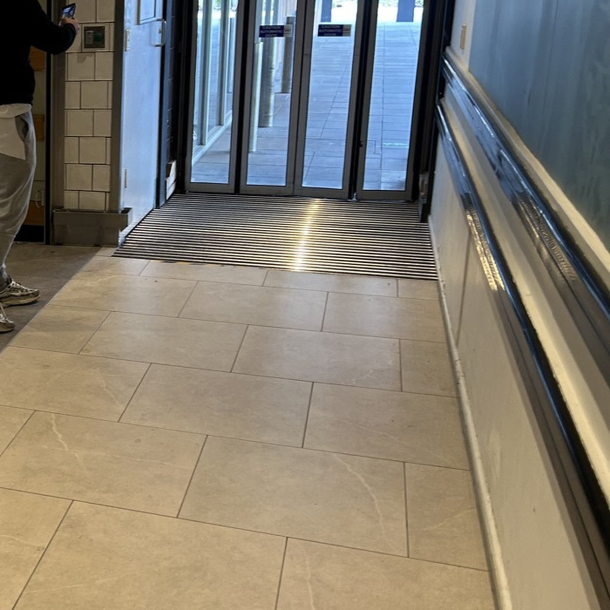 TC02 Dual-Action Aluminium Scraper Matting Installed at High-Traffic Commercial Sliding Doors