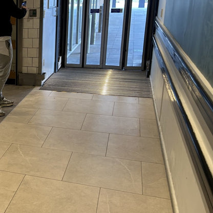 TC02 Dual-Action Aluminium Scraper Matting Installed at High-Traffic Commercial Sliding Doors